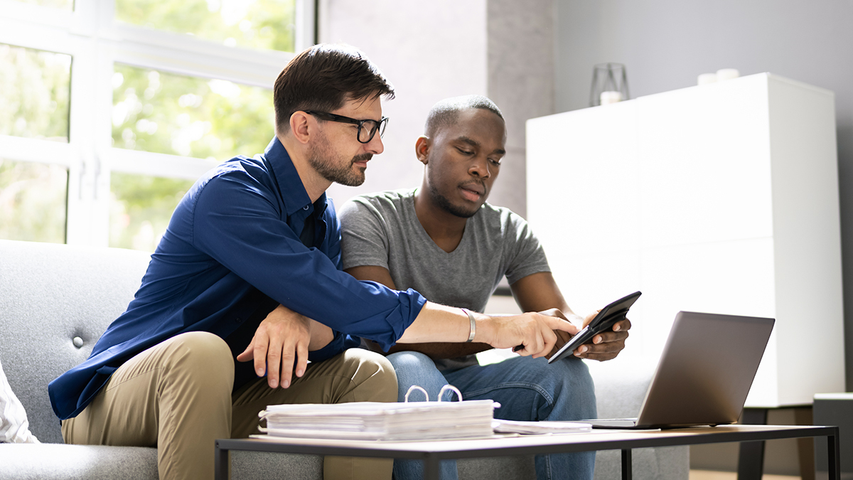 two men looking over documents