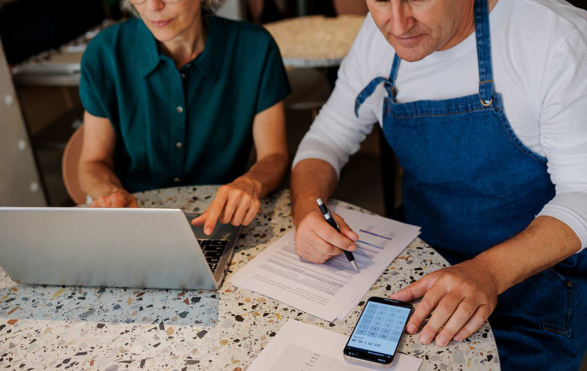 two people looking over documents