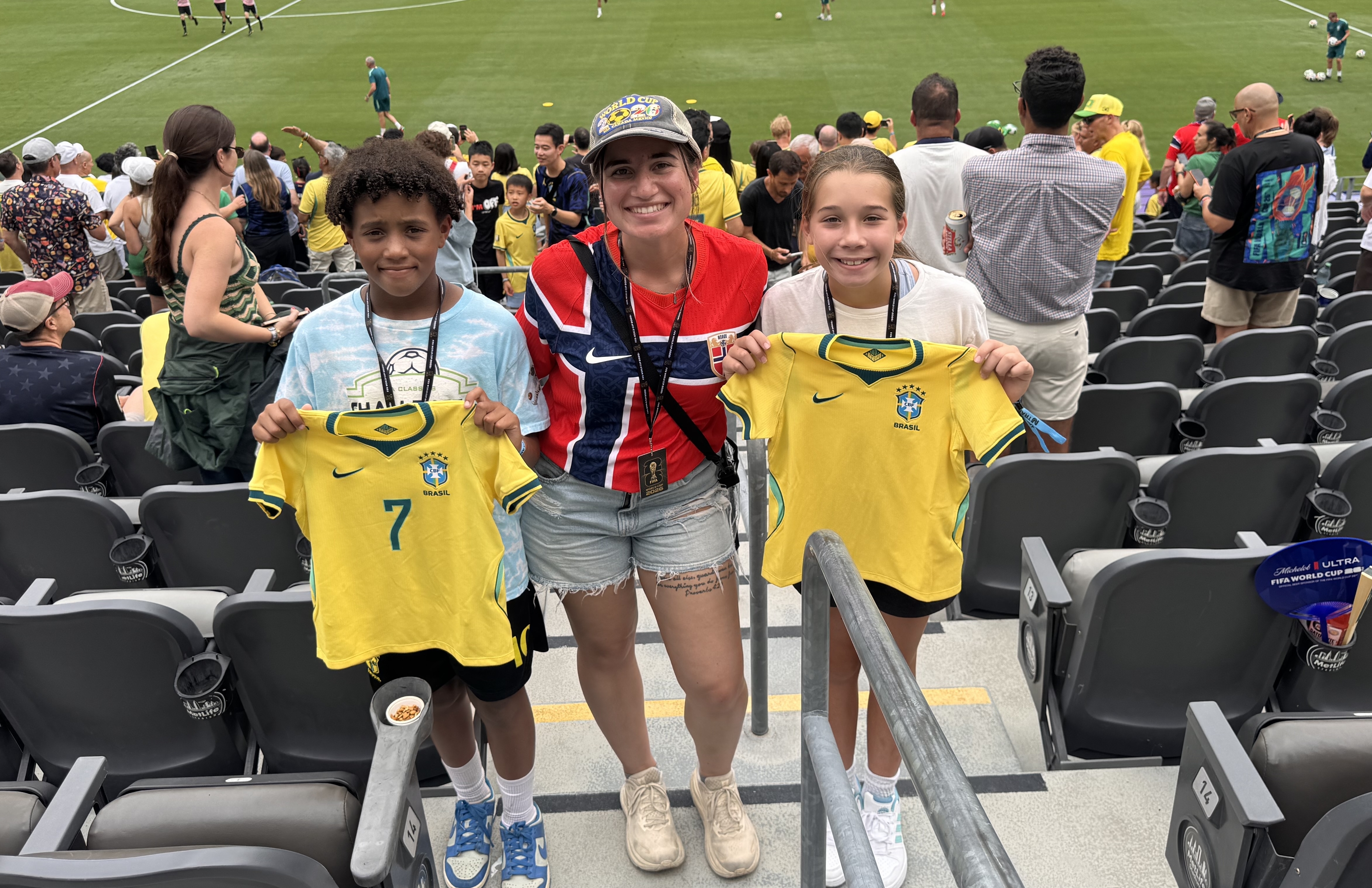 Coach Krista Porjero (center) with two young players at the World Cup Match