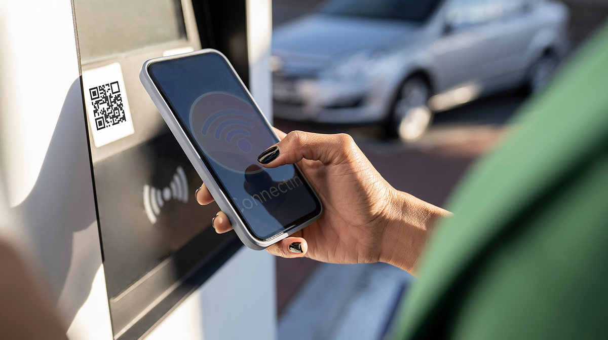 Person scanning QR Code