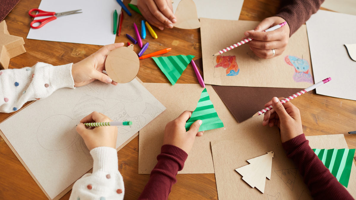 Close up of children's hands doing holiday crafts