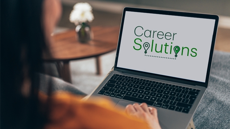 Employee with laptop exploring careers resources page