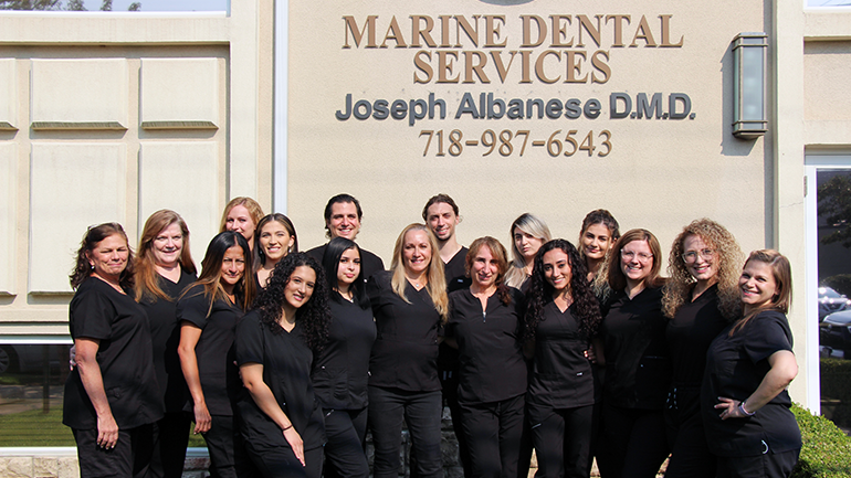 Marine Dental Services staff in front of their office