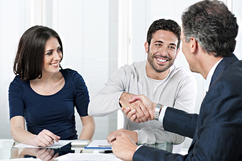 financial adviser talking to couple