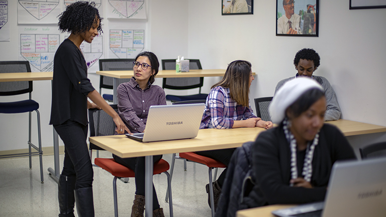 Teacher working with students