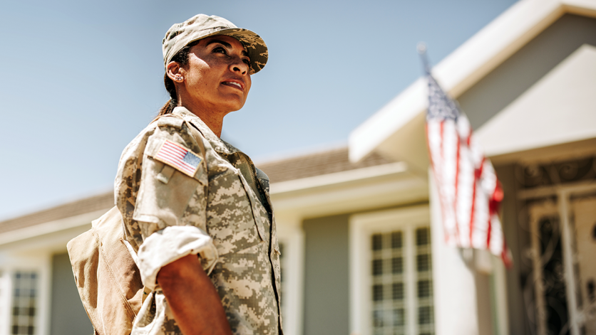 Woman veteran in front of American flag