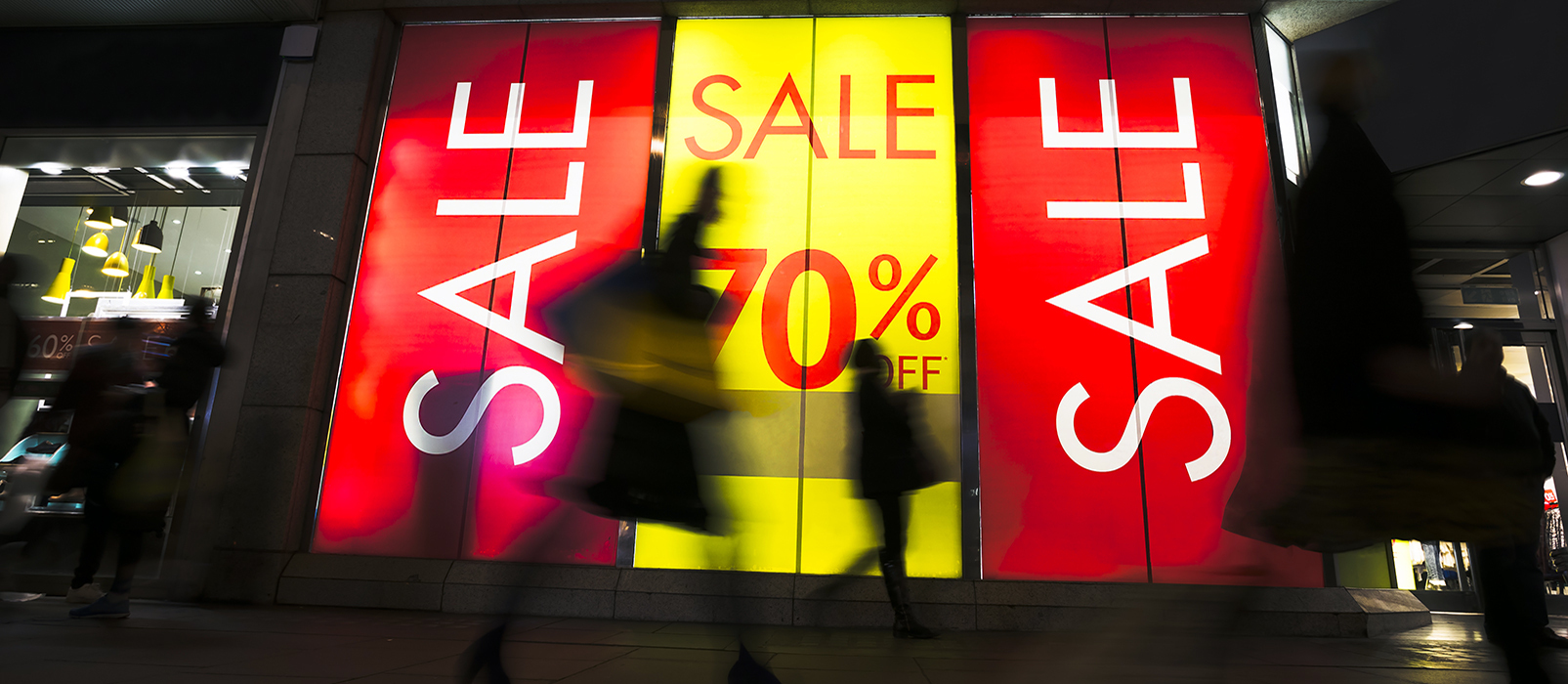 Sale signs on a storefront window