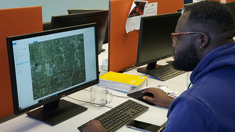 man looking at computer screen