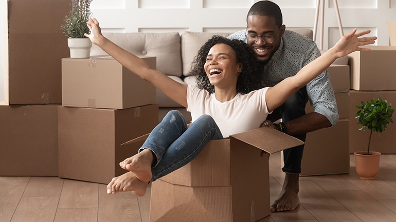couple in process of moving, girl in a box
