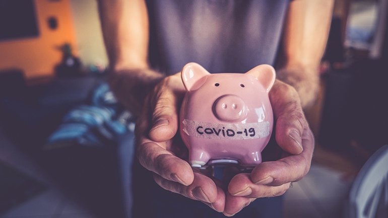 Piggy bank that says "COVID-19" on it