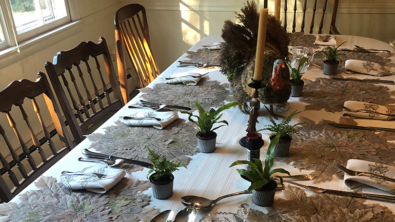 table setting with turkey decoration in the middle