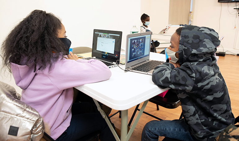 students working on laptops