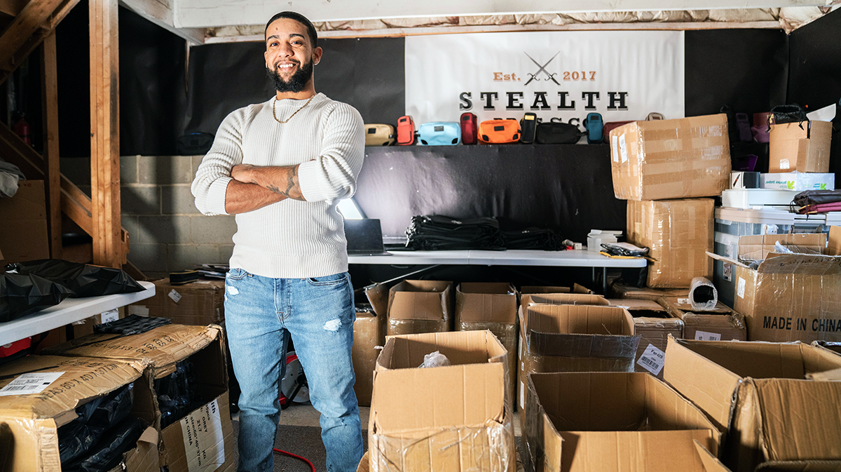 Braxton Fleming surrounded by boxes of kits