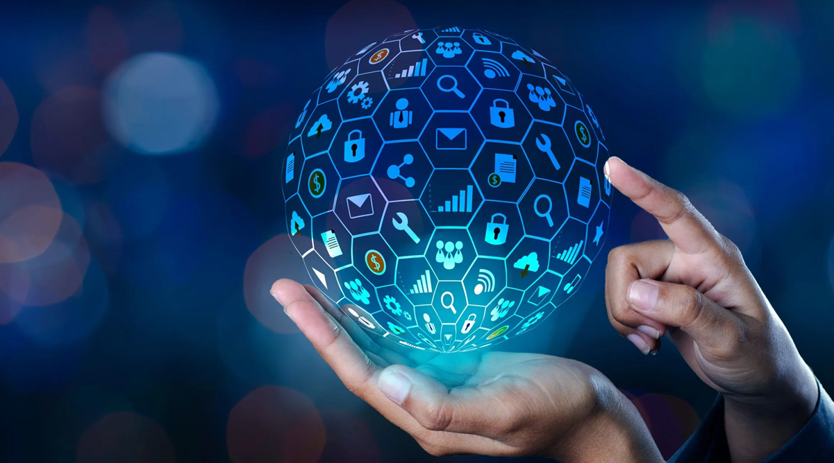 Hand holding sphere graphic of symbols