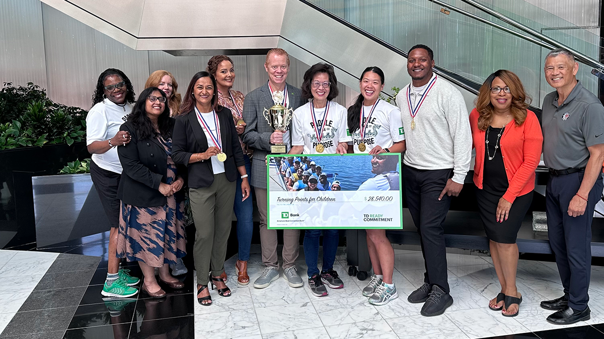 Arkeem Graves, Kathy Wong and TD colleagues at the Dragon Boat Regatta Check Ceremony