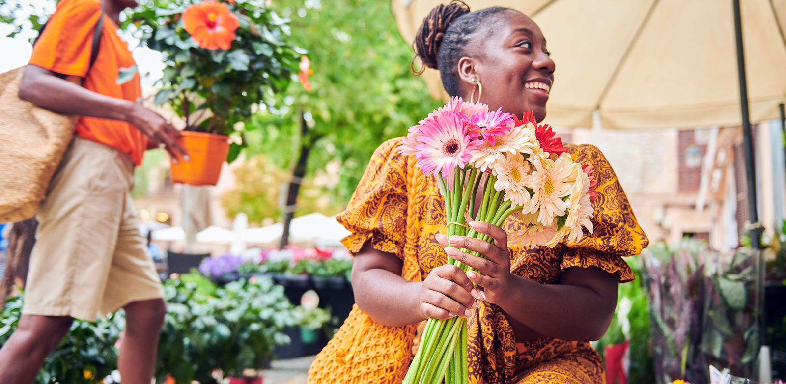 Woman buying flowers at a farmer's market