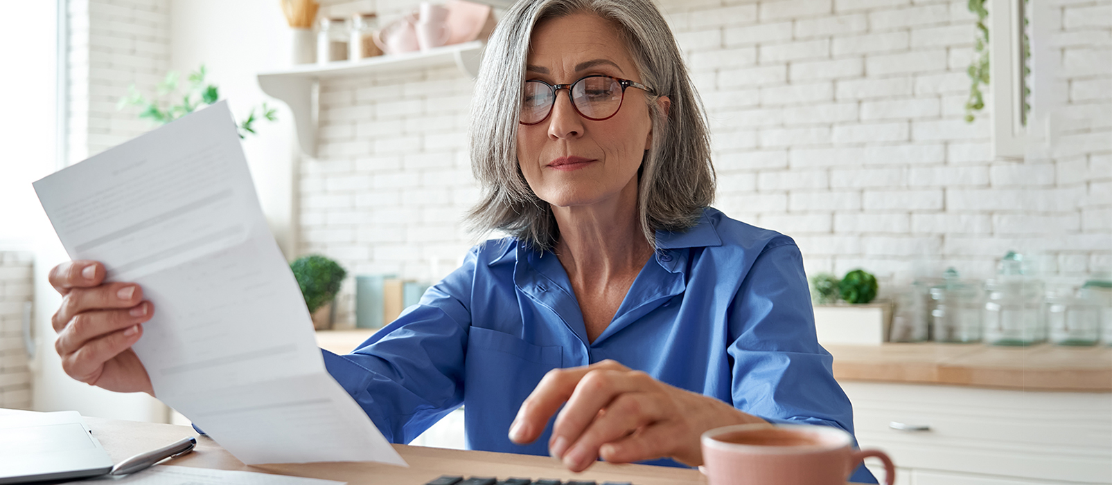 older woman looking at documents