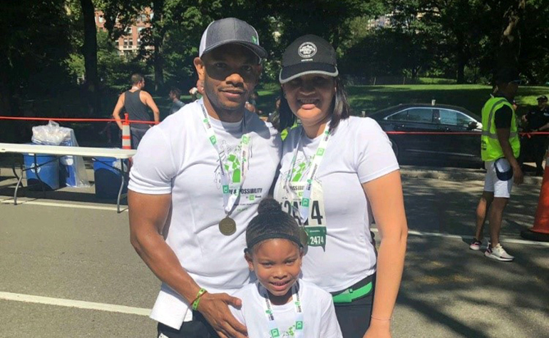 Marcus with his wife and daughter