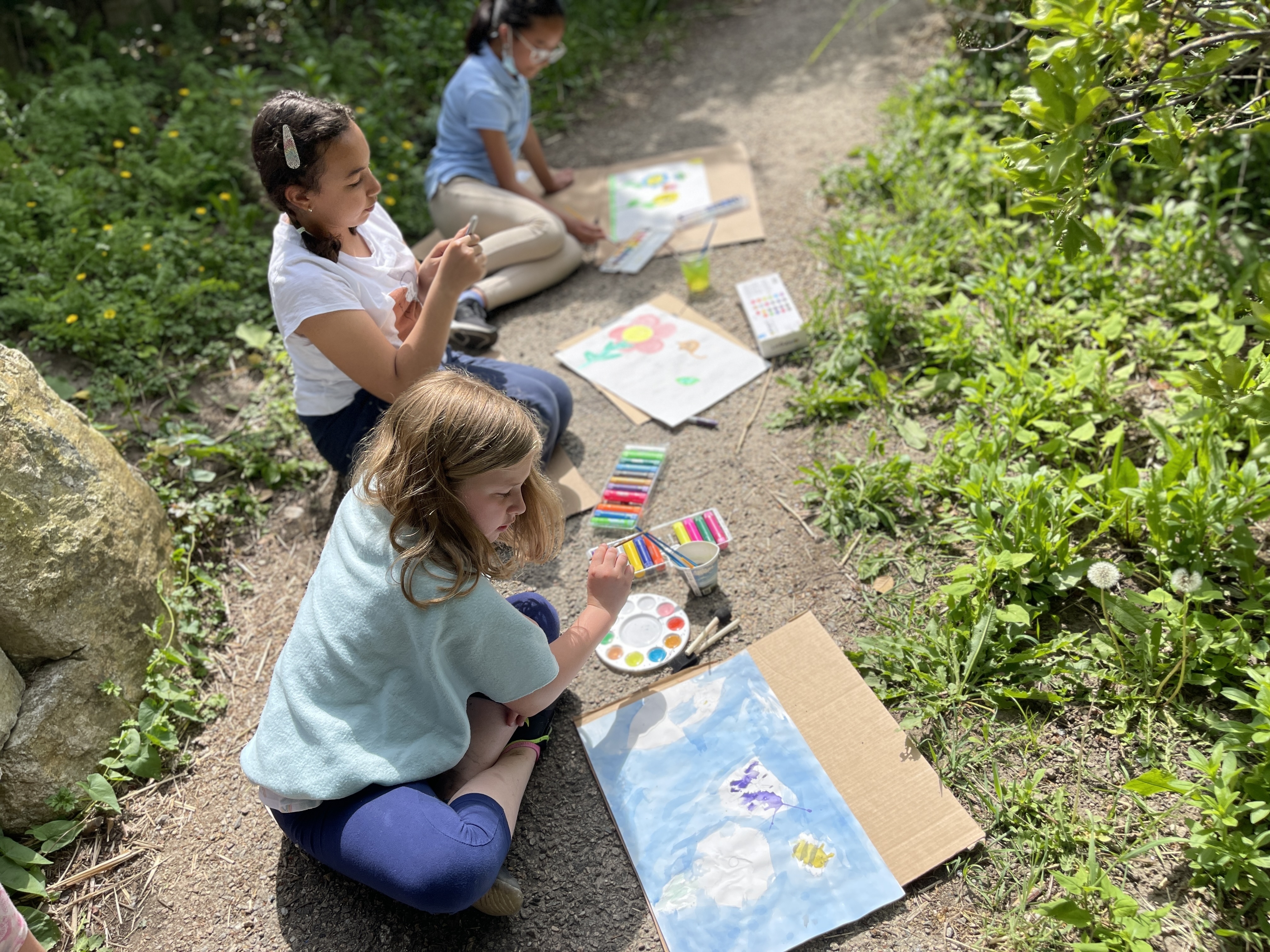 children coloring outside