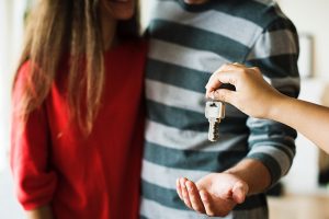 couple being handed keys