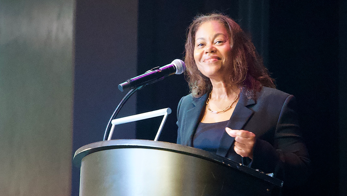 Regina Hairston, President and CEO of the African American Chamber of Commerce of PA, NJ & DE talking at a podium