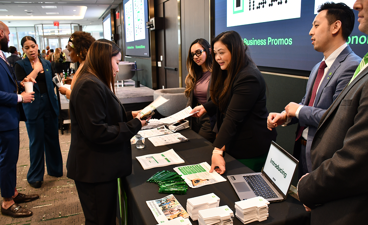 People at check-in table at NY small business month event