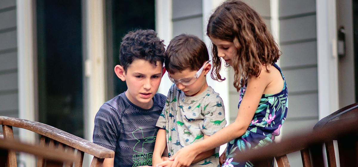 Benjamin, Adam, and Sarah standing together