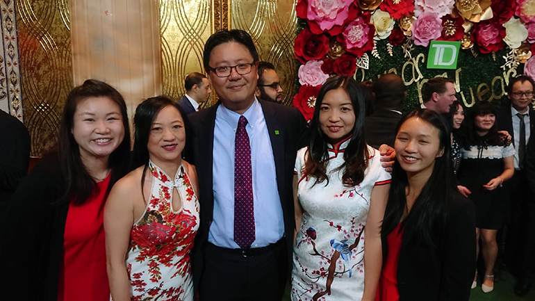 Xihao with a group of people at a TD event celebrating Asian culture